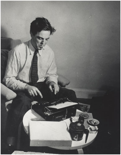 Lomax at typewriter 1942