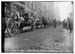 Garbage carts protected by police (LOC)