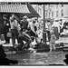 Summer scene, N.Y. - drinking water from street pump (LOC)