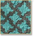 Quilt with the pattern "drunkard's path" made by Lura Stanley of Laurel Fork, West Virginia
