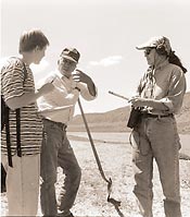 During the 1994 American Folklife Center's field school in San Luis, Colorado, Laura Hunt (left) and Beverly Morris (right) interview Corpus Gallegos on the vega, a cattle grazing area held in common by the community.