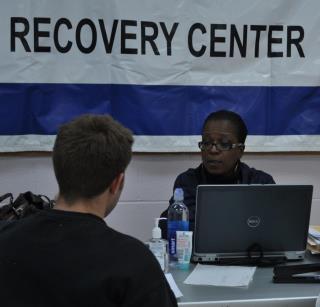 Photo: Morris Plains, N.J., Nov. 10, 2012 -- Homeowner Patrick Yannotta receives assistance during the registration process from Karin Pearson who is a FEMA representative at the Morris Plains Disaster Recovery Center. The Small Business Administration, a federal partner of FEMA, is also available at Morris Plains to assist in the recovery process for survivors of Hurricane Sandy. Photo by Sharon Karr/FEMA