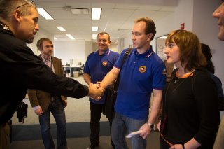 Photo: Alexander Romanov, Director of Federal-State Russian Airmobile Rescue Service, Moscow, and Alexey Audeev, Deputy Director of International Cooperation Department EMERCOM of Russian (r-l, blue polo shirts), meet with FEMA Geographic Information Specialists during a tour of FEMA's DR-4085 Joint Field Office (JFO) in Queens, New York. Following the onslaught of Hurricane Sandy, FEMA coordinates its work in New York at the FEMA JFO in Queens and supports state, local, tribal and volunteer agencies in their disaster response activities. FEMA also welcomes the cooperation and assistance of international experts such as the Russian Airmobile Rescue Service who are familiar with disaster response techniques needed to assist communities in need of relief.  Photo by Christopher Mardorf / FEMA. Public Domain