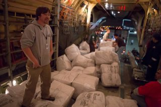 Photo: FEMA organizes volunteers from Americorps,and US Customs, to unload 20,000 donated blankets from Russia, in support of non-governmental agencies providing survivor assistance to those in the area impacted by Hurricane Sandy. Public Domain