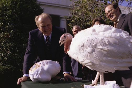 Gerald Ford is presented with a Thanksgiving turkey