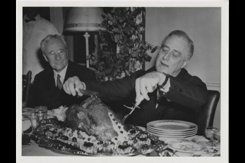 Franklin D. Roosevelt carving the Thanksgiving turkey