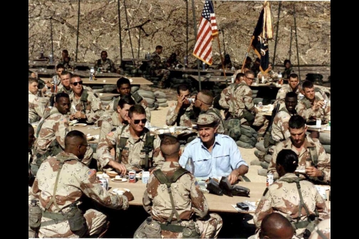 George Bush celebrating Thanksgiving with the troops