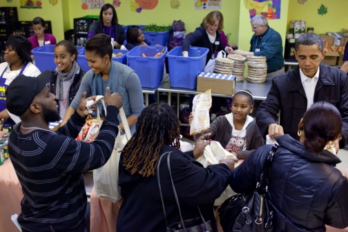 President and Family distribute food for Thanksgiving at Martha's Table