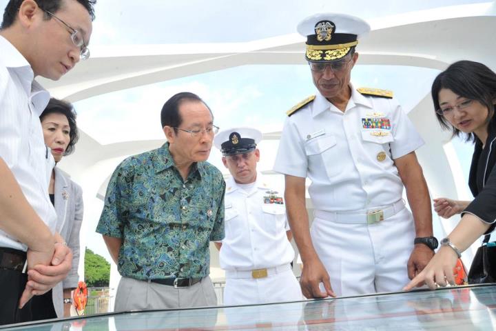 Photo: PEARL HARBOR (Nov. 5, 2012) Adm. Cecil D. Haney, commander of the U.S. Pacific Fleet; and Mayor Norio Tomonaga of Sasebo, Japan, left center, and his wife Takako, left, discuss a diagram of USS Arizona with the assistance of interpreters during a visit to the memorial. Mayor Tomonaga and Masayuki Nagayama, chairman of the Sasebo City Assembly, placed wreaths on the memorial during the visit, hosted by Haney. (U.S. Navy photo by Mass Communication Specialist 2nd Class Amanda Dunford)