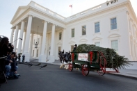 First Lady Michelle Obama Receives the 2012 White House Christmas Tree