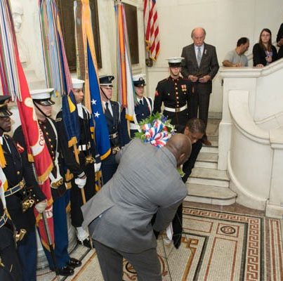 Photo: Acting Public Printer Davita Vance-Cooks and Veteran Martin Prailow lay a wreath at GPO's Veteran's Wall.