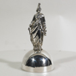 Silver bell; the handle is a likeness of the allegorical figure, Columbia.