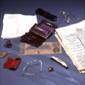 The contents of Abraham Lincoln’s pockets from April 14, 1865. Image includes newspaper reporting his assassination.