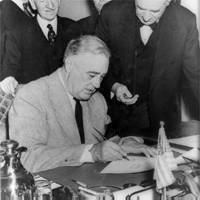 President Roosevelt signs the Declaration of War against Japan, December 1941
