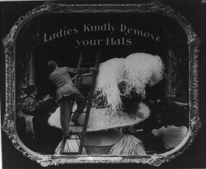 theater notice asking ladies to remove hats