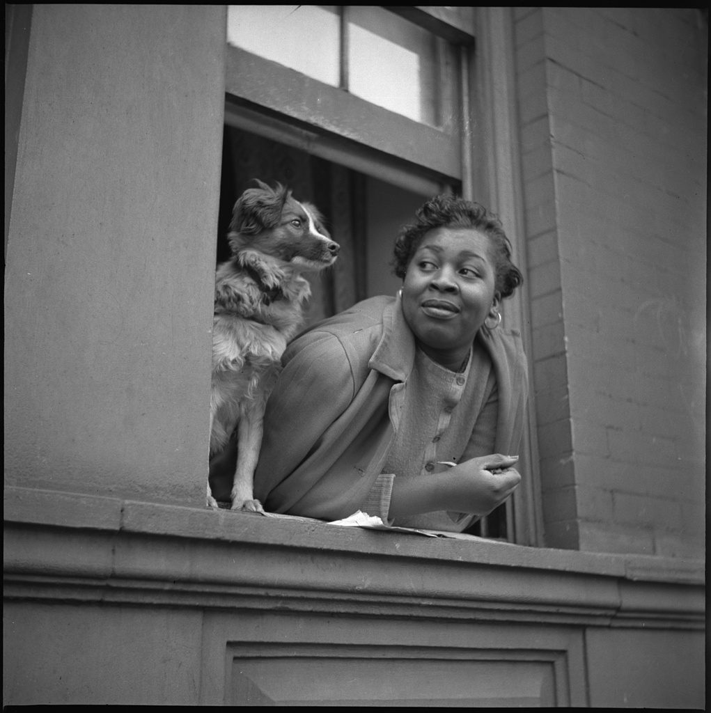 New York, New York. A woman and her dog in the Harlem section. Photo by Gordon Parks, 1943 May