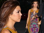 Kourtney, 33, teamed the colourful dress with a pair of black sandals and a handbag as she checked into her hotel in Miami.
