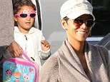 Everything's just fine! Halle Berry puts on a display of determined cheer as she drops little Nahla off at school 