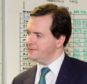 Doing the maths: George Osborne on his visit to HM Revenue & Customs ahead of his mini-budget today