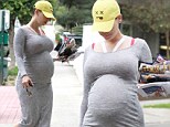 Glowing in grey! Heavily pregnant Amber Rose displays her huge belly in a tight Lycra dress as she forgoes her usual heavily made-up look 