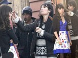 New curl! Zooey Deschanel gets her famous raven locks coiffed as she films scenes for her hit show 