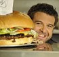 You've seen Man Vs. Food, now it's time for FEMAIL Vs. Food: Adam Richman teaches one writer how to tackle the challenge of eating a 5lb burger and chips in 30 minutes