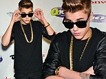 Blinded by the bling! Justin Bieber dons heavy gold necklace and dark sunglasses at Q102's Jingle Ball in Philly