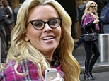 She's got specs appeal! Jenny McCarthy spices up her casual outfit by slipping on Fifties-style cat-eye reading glasses and sexy leather boots 