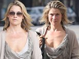 If you can't find a phonebox... Heroes star Ali Larter transforms herself from ordinary mom to super-hot star during salon trip 
