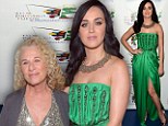 A definite hit! Katy Perry dazzles in green gown split to the thigh as she poses with legendary songwriter Carole King