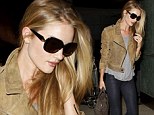 Supermodel chic! Rosie Huntington-Whiteley dons a pair of her favourite skinny jeans as she jets back to LA