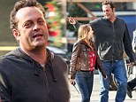 Gigantic proportions: Vince Vaughn towers above his PA on the set of The Delivery Man in New York City