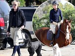Doggy day care: Ally McBeal actress Portia de Rossi takes her dogs to an equestrian centre in Los Angeles 