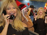Deal or no deal: Goldie Hawn beams as she picks up the phone and takes part in the 20th ICAP Charity Day