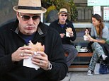That's a Big burger: Chris Noth makes a meal out of falafel snack... and ends up with sauce around his chops