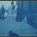 [Frances Benjamin Johnston on a balcony of the State, War and Navy Building with a tripod-mounted camera, photographing an unidentified man] (LOC)