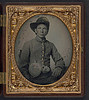 [Unidentified young soldier in Confederate shell jacket, Hardee hat with Mounted Rifles insignia and plume with canteen and cup] (LOC) by The Library of Congress