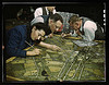 Camouflage class in New York University, where men and women are preparing for jobs in the Army or in industry, New York, N.Y. They make models from aerial photographs, re-photograph them, then work out a camouflage scheme and make a final photograph (LOC by The Library of Congress