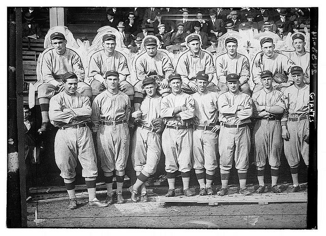 [New York Giants. Top row (left to right): Rube Marquard, Larry Doyle, Josh Devore, Art Fletcher, George Burns, Art Wilson, Red Ames. Bottom row: Chief Meyers, Fred Snodgrass, Red Murray, Arlie Latham, Beals Becker, John McGraw, Buck Herzog, Fred Merkle (