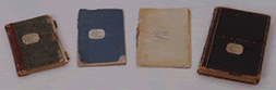 The four Walt Whitman notebooks before restoration begins