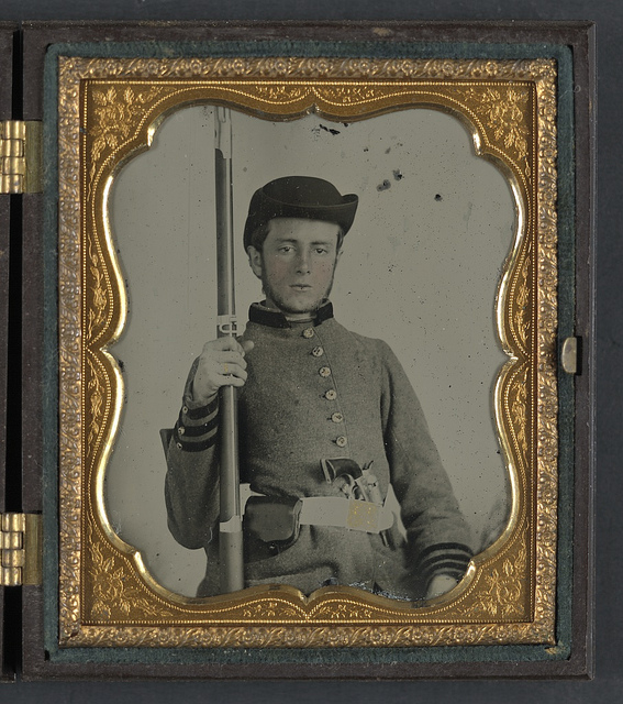 [Private Peter Lauck Kurtz of Company A, 5th Virginia Infantry Regiment, in uniform with musket and revolver] (LOC)
