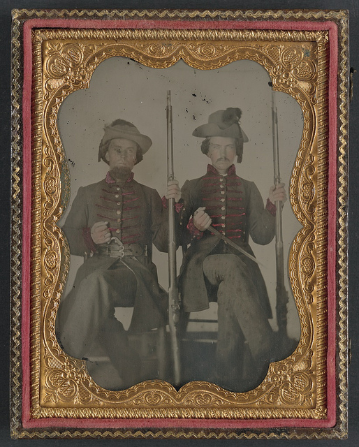 [Two unidentified soldiers in Confederate uniforms with muskets and knives] (LOC)