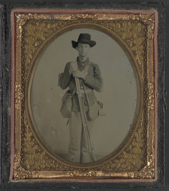 [Unidentified soldier in uniform with musket, canteen, cup, and haversack; either Confederate or Union] (LOC)