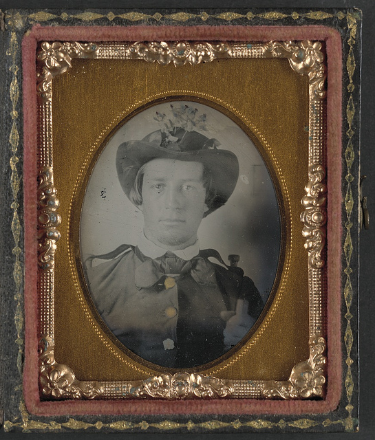 [Private Thomas Bobo of H Company, 5th South Carolina Infantry Regiment; H Company, 9th South Carolina Infantry Regiment;  K Company,1st South Carolina Light Artillery Regiment in uniform and hat decorated with flowers] (LOC)