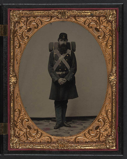[Unidentified soldier in Union frock coat and Company C, 71st Regiment forage cap with knapsack and bedroll] (LOC)