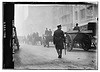Police protecting garbage carts (LOC) by The Library of Congress