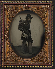 [Private Albert H. Davis of Company K, 6th New Hampshire Infantry Regiment in uniform, shoulder scales, and Hardee hat with Model 1841 Mississippi rifle, sword bayonet, knapsack with bedroll, canteen, and haversack] (LOC)