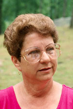Candid portrait of a woman wearing glasses.