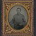 [Unidentified soldier in Confederate shell jacket with "I" buttons] (LOC)