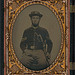 [Unidentified soldier in Union corporal's uniform and 17th regiment cavalry slouch cap with U.S. Model 1860 cavalry saber] (LOC)